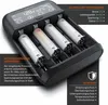 A close-up view of a battery charger with four AA batteries inserted, showing its LCD display and various features. Produktbild-Vorschau