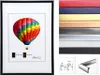 A framed picture of a hot air balloon with a selection of frame colors and frame profile diagrams. Produktbild-Vorschau