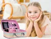 A young girl is lying on the floor next to an open makeup case. Voir les images du produit