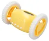 A yellow digital alarm clock with wheels is shown against a white background. Podgląd zdjęcia produktu