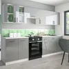 A modern, high-gloss gray kitchen with a white countertop and a green hexagonal backsplash. Náhled obrázku produktu