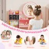 A young girl is looking in the mirror of a pink children's vanity set. The image also shows four smaller circular insets at the bottom, each depicting children engaged in activities like drawing, writing, dressing up, and reading. Voir les images du produit