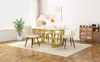A dining room scene with a table and chairs, a plant, and a cabinet. Podgląd zdjęcia produktu