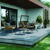 An outdoor patio with furniture and a swing. Produktbild-Vorschau