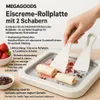 A hand is shown using two spatulas to make rolled ice cream on a MEGAGOODS ice cream rolling plate. Strawberries and chocolate shavings are visible nearby. Náhled obrázku produktu