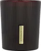 A close-up studio shot of a scented candle in a dark brown ribbed glass jar with a gold label. Produktbild-Vorschau
