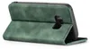 A green flip case for a smartphone is shown from a side angle, with the front cover folded back. Produktbild-Vorschau