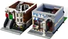 Two Lego buildings, a pet shop and a residential building, are shown from a slightly elevated angle. Náhled obrázku produktu