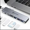 A USB C hub is shown connected to a laptop, with other USB drives and SD cards displayed around it. Produktbild-Vorschau