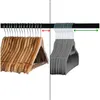 Two types of clothes hangers are shown hanging from a rod, separated by a dashed line. Produktbild-Vorschau