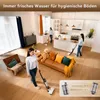 A modern living room and kitchen area with people using a wet dry vacuum cleaner. Produktbild-Vorschau