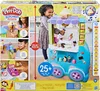 The image shows the packaging of a Play-Doh Kitchen Creations Ultimate Ice Cream Truck Playset. It features children playing with the toy, demonstrating its features and contents. Náhľad obrázku produktu
