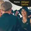 People dressed in 1920s attire at an event. Produktbild-Vorschau
