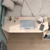 A desk attached to a bed, with a laptop, headphones, and phone on it. Produktbild-Vorschau