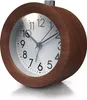 A close-up, studio shot of a round, analog alarm clock with a wooden frame and a white face. Náhľad obrázku produktu