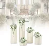 A wedding ceremony or event setup in a church, with floral decorations and white columns. Podgląd zdjęcia produktu