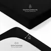 A close-up view of a black fitted sheet, showing its texture and elastic band, with superimposed text and icons highlighting product features. Produktbild-Vorschau