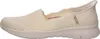 A side view of a single cream-colored Skechers slip-on shoe. Produktbild-Vorschau