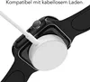 A close-up shot of an Apple Watch being charged wirelessly. Produktbild-Vorschau