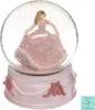 A pink musical snow globe with a princess figurine inside, displayed on a pink base with decorative bows and pearls. Náhled obrázku produktu
