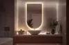 A modern bathroom vanity with a large, illuminated mirror above a vessel sink. Produktbild-Vorschau