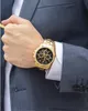 A man in a suit wearing a gold Maserati watch. Náhled obrázku produktu