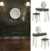 A vanity set with a lighted mirror and stool, set against a patterned wallpaper. Náhľad obrázku produktu
