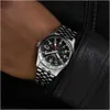 A close-up shot of a person's wrist wearing a Seiko 5 GMT watch, with a black leather jacket visible. Produktbild-Vorschau