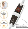 A close-up of a Beurer heating pad controller with marketing graphics and text. Produktbild-Vorschau
