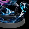 A close-up view of a figurine's base and lower legs, featuring dynamic blue energy effects. Náhled obrázku produktu