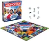 A Monopoly board game box and board with football player imagery, along with game pieces. Produktbild-Vorschau