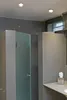 A modern bathroom interior with a shower stall and a vanity area. Produktbild-Vorschau