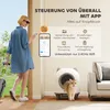 A woman is using her phone to control a self-cleaning litter box, with a cat emerging from it. Produktbild-Vorschau