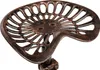 A close-up studio shot of a bronze tractor seat. Náhľad obrázku produktu