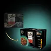 A product shot of Sheba cat food packaging with an arrow pointing from one box to another, suggesting a comparison or transition. Náhled obrázku produktu