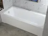 A white rectangular bathtub with a white housing is shown in a bathroom setting with marble-tiled walls and a marble-patterned floor. Produktbild-Vorschau