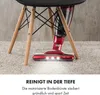 A red cordless vacuum cleaner is shown cleaning a carpet under a chair. Produktbild-Vorschau