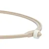 A close-up shot of a beige universal turntable ring for a microwave, with a white roller. Produktbild-Vorschau