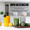 A yellow juicer is shown on a kitchen counter with two glasses of juice and some produce. Náhľad obrázku produktu