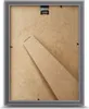 The back of a gray picture frame with a brown backing board and a stand. Produktbild-Vorschau