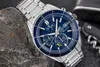 A close-up shot of a men's wristwatch with a blue face, resting on a rock. Náhľad obrázku produktu
