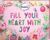 A pink advent calendar with Christmas-themed decorations and text. Produktbild-Vorschau