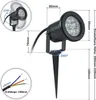 A black LED garden spotlight with a ground spike, shown with dimensions and adjustment angles. Náhled obrázku produktu