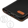 Close-up view of a phone case showing ports and a leather tag. Anteprima dell’immagine prodotto