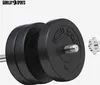 A close-up shot of black weight plates with the brand name 'GORILLA SPORTS' embossed on them, along with a silver locking collar. The weights are stacked on a barbell. Náhled obrázku produktu