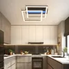 A modern kitchen with sleek cabinetry and a stylish ceiling light. Voir les images du produit