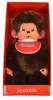 A Monchhichi doll is presented in its red packaging. Produktbild-Vorschau
