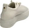 A close-up, side view of a white leather sneaker with a platform sole. Voir les images du produit