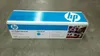 A product box for an HP toner cartridge is shown on a gray surface. Náhled obrázku produktu