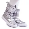 A pair of silver snow boots worn by a person. Produktbild-Vorschau